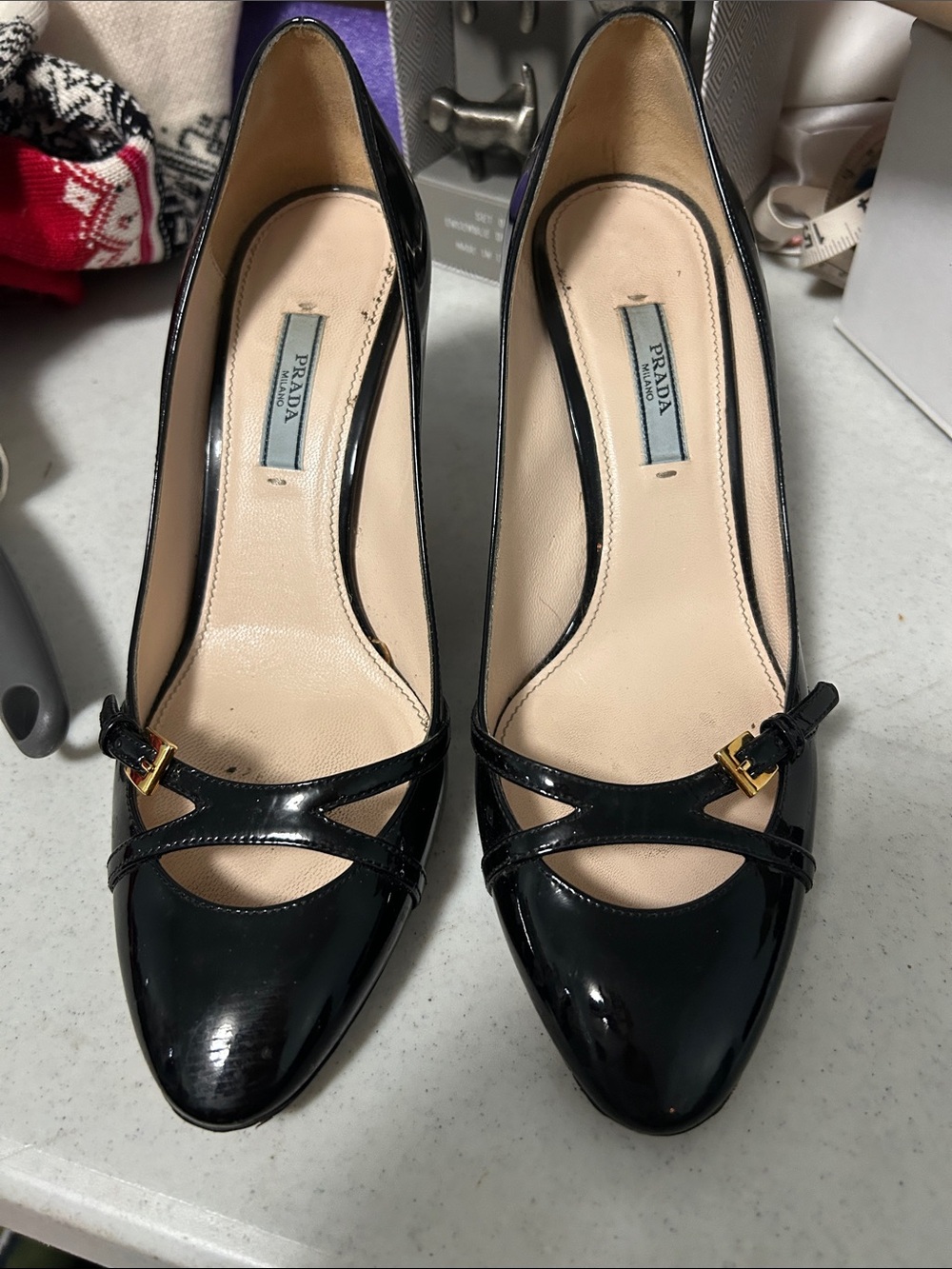 Prada Black Patent Leather Cross-Strap Pumps with Gold Accent